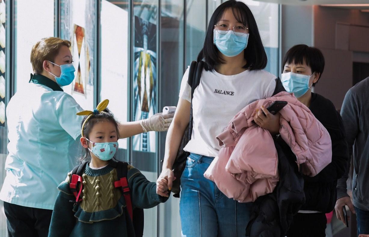 U mnogim oblastima Kine obavezno je nošenje maski - Avaz
