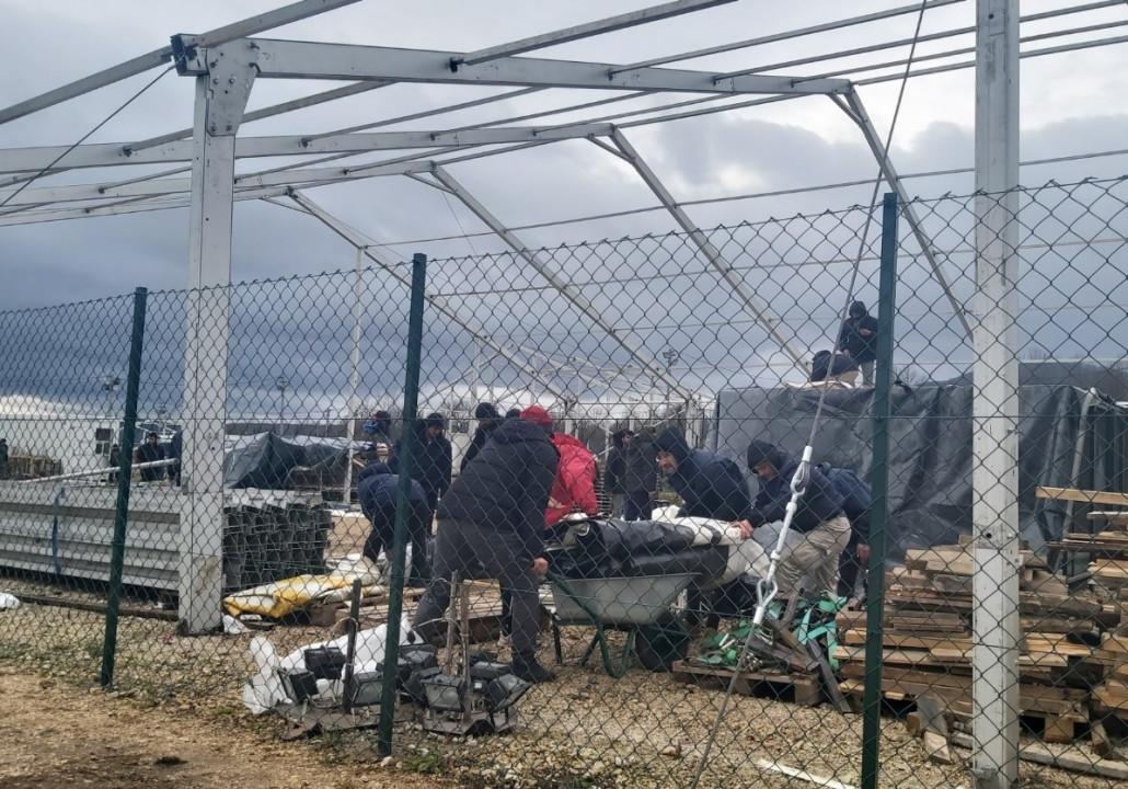 Migrants return to the burned camp site "Lipa", the Red Cross distributes food to them