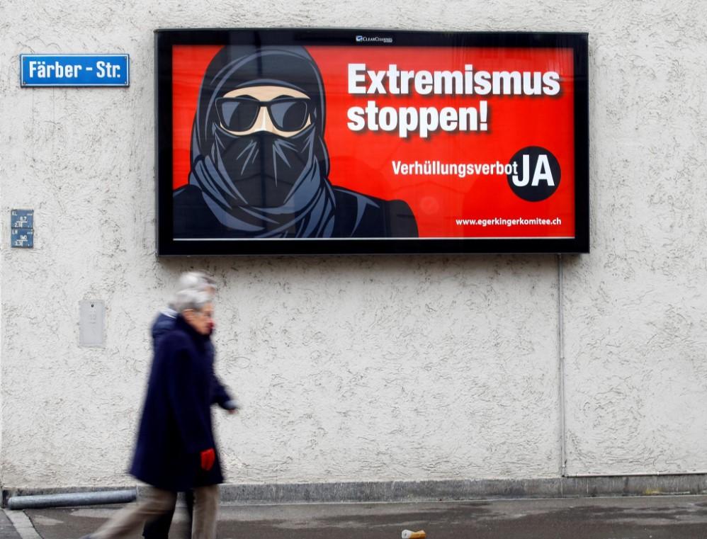 A poster of the initiative committee against wearing the burqa (Verhuellungsverbot) reading "Stop extremism! Veil ban - Yes" is seen in Zurich Switzerland February 15, 2021. - Avaz
