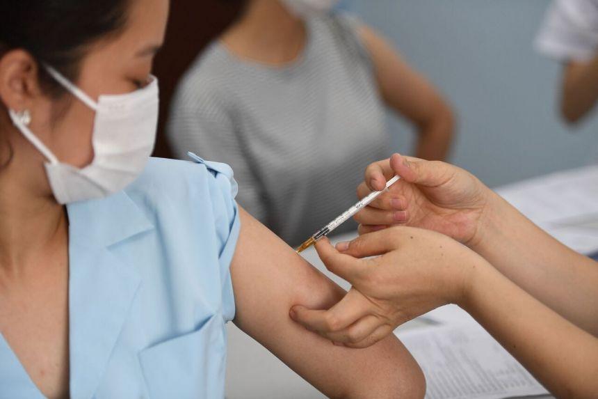 Vietnam races to vaccinate factory workers after record virus cases