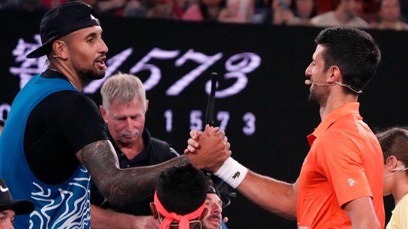 Australia's Nick Kyrgios, left, and Serbia's Novak Djokovic shake hands following an exhibition match on Rod Laver Arena ahead of the Australian Open tennis championship in Melbourne - Avaz