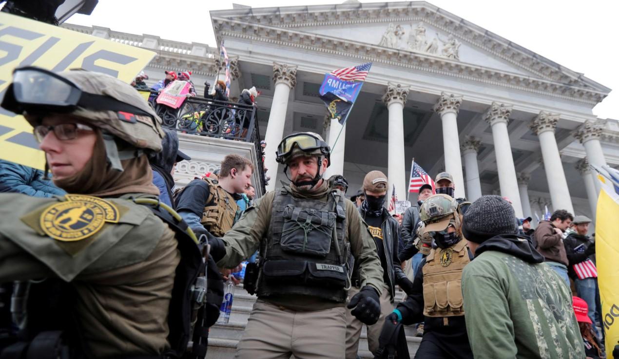 Jessica Marie Watkins (Left) and Donovan Ray Crowl (Center), both from Ohio, march down the East front steps of the U.S. Capitol with the Oath Keepers militia group among supporters of U.S. President Donald Trump protesting against the certification of the 2020 U.S. presidential election results by the U.S. Congress, in Washington, U.S., January 6, 2021. - Avaz