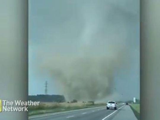 A video shared on social media showed a fast-moving, wide column of swirling dust approaching a road, whilst another captured an almost apocalyptic scene as cars stopped on a highway with the tornado directly ahead - Avaz