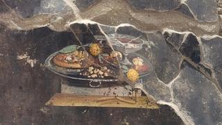 That's no pizza: A wall painting found in Pompeii doesn't depict Italy's iconic dish