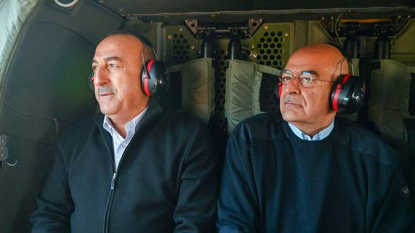 In this photo provided by the Greek Foreign Ministry, Greece's Foreign Minister Nikos Dendias, right, accompanied by his Turkish counterpart, Mevlut Cavusoglu fly over the earthquake-stricken areas of Turkey, Sunday - Avaz