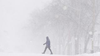 Snowstorms flank US, with Northeast, California digging out