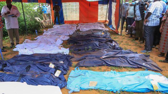 Body bags are laid out at the scene where dozens of bodies have been found in shallow graves - Avaz