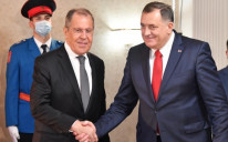Russian Foreign Minister Sergey Lavrov, left, meets the chairman of Bosnia and Herzegovina's tripartite presidency, Milorad Dodik, right, in Sarajevo