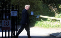 Britain's Prime Minister Boris Johnson walks at Downing Street in London, Britain April 5, 2021. 
