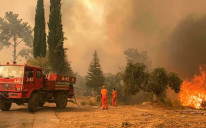 The soaring flames turned summer skies dark orange over five-star hotels and villages dotting rolling hills that have been parched by another dry summer