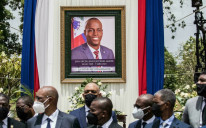 A portrait of late Haitian president Jovenel Moise is seen at a ceremony in his honor in Port-au-Prince on July 20, 2021 