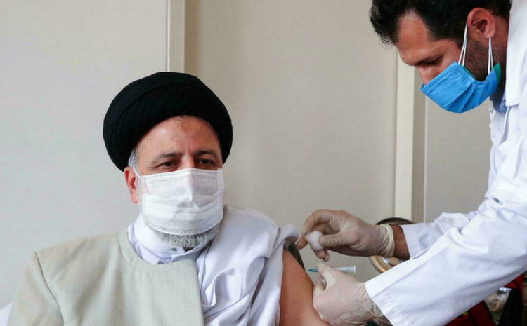 A handout picture provided by the Iranian presidency on August 8, 2021, show President Ebrahim Raisi receiving a dose of the domestically-produced coronavirus vaccine "COVIran Barekat" in the capital Tehran 